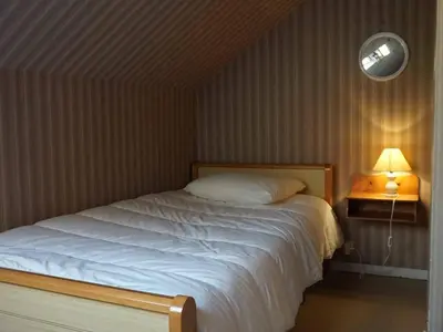 Un ou plusieurs lits dans un hébergement de l'établissement Duplex lumineux 3 chambres, terrasse, parking, à deux pas de la plage de Cabourg - FR-1-465-103