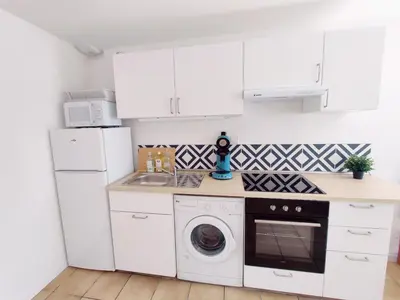 Cuisine ou kitchenette dans l'établissement Maison 30m2 - 1 chambre - Jardin