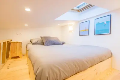 Un ou plusieurs lits dans un hébergement de l'établissement Joyful tiny house seaside