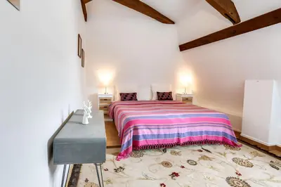 Un ou plusieurs lits dans un hébergement de l'établissement Château Turgot Gîtes