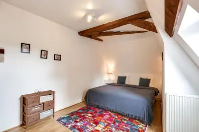 Un ou plusieurs lits dans un hébergement de l'établissement Château Turgot Gîtes