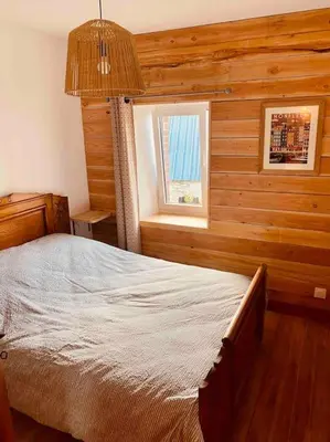 Un ou plusieurs lits dans un hébergement de l'établissement Jolie maison à la campagne « Chez Germaine »