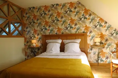 Un ou plusieurs lits dans un hébergement de l'établissement Maison chic proche du Mont Saint Michel