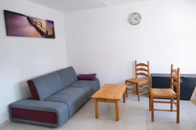 Coin salon dans l'établissement Maison Cosy proche Plage - Cour & Parkings