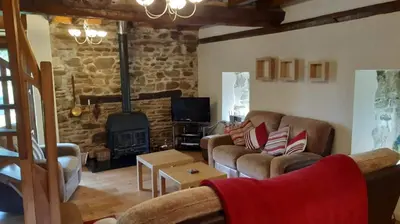 Coin salon dans l'établissement Le Moulin des Hiboux - Gite avec salle de jeux games room