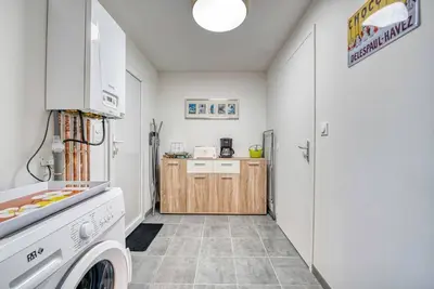 Cuisine ou kitchenette dans l'établissement Le Nid Familial de Merville Maison neuve proche Plage 6 pers