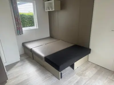 Un ou plusieurs lits dans un hébergement de l'établissement Mobil home Ouistreham