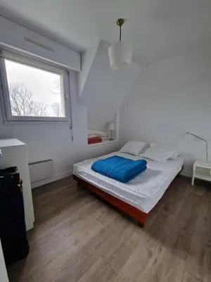 Un ou plusieurs lits dans un hébergement de l'établissement Appartement charmant bord de mer