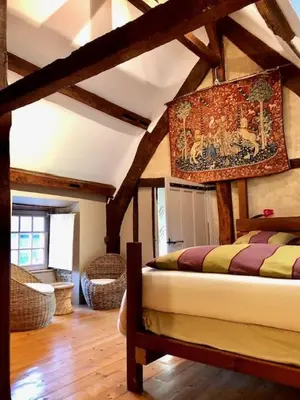 Un ou plusieurs lits dans un hébergement de l'établissement La maison sur les remparts