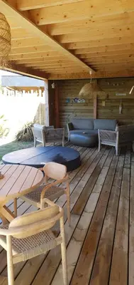 Coin salon dans l'établissement Maison de plage Manoga