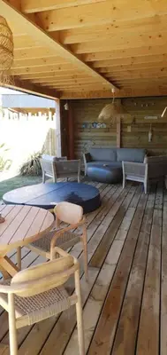 Coin salon dans l'établissement Maison de plage Manoga