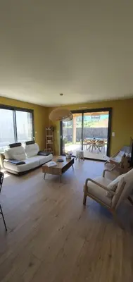 Coin salon dans l'établissement Maison de plage Manoga