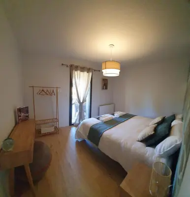 Un ou plusieurs lits dans un hébergement de l'établissement Maison de plage Manoga