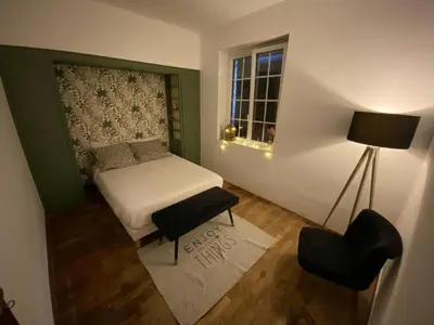Un ou plusieurs lits dans un hébergement de l'établissement Chambre hôtes