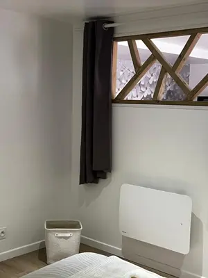 Un ou plusieurs lits dans un hébergement de l'établissement Ambiance cocooning pour visiter la Normandie