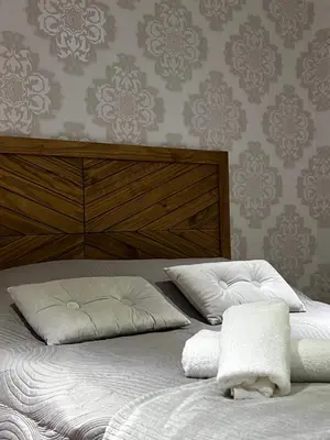 Un ou plusieurs lits dans un hébergement de l'établissement Ambiance cocooning pour visiter la Normandie