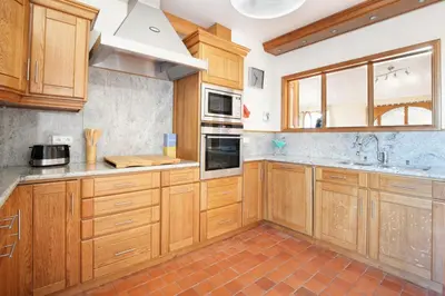 Cuisine ou kitchenette dans l'établissement L'Abri du Repos - Appt vue sur le port