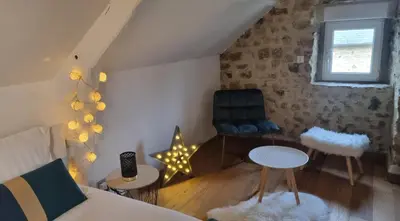 Coin salon dans l'établissement Chambre Colomby Kaabi