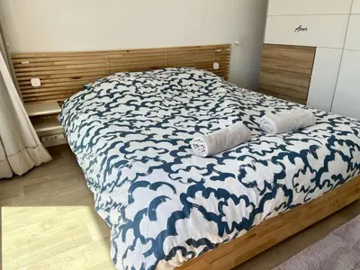 Un ou plusieurs lits dans un hébergement de l'établissement La Land, appartement traversant vue mer