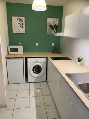 Cuisine ou kitchenette dans l'établissement Appartement Port-En-Bessin Mer Proche