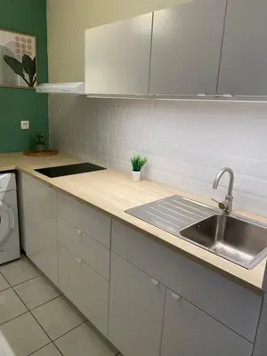 Cuisine ou kitchenette dans l'établissement Appartement Port-En-Bessin Mer Proche