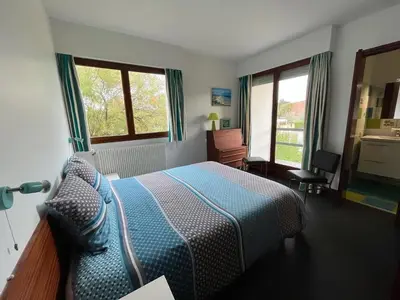 Un ou plusieurs lits dans un hébergement de l'établissement Villa d'architecte - Les Pieds dans l'Eau