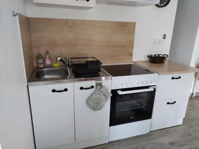 Cuisine ou kitchenette dans l'établissement Ti Korrigan