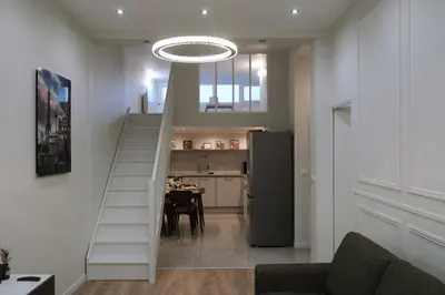 Cuisine ou kitchenette dans l'établissement Appartement mezzanine contemporain hypercentre Caen - chez Jannie