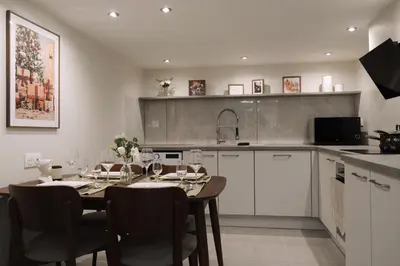 Cuisine ou kitchenette dans l'établissement Appartement mezzanine contemporain hypercentre Caen - chez Jannie