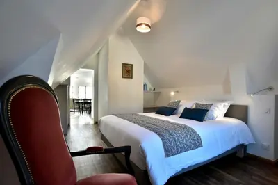 Un ou plusieurs lits dans un hébergement de l'établissement LOstra 2 - Appartement avec mezzanine, front de mer à Cancale sur le Port de La Houle