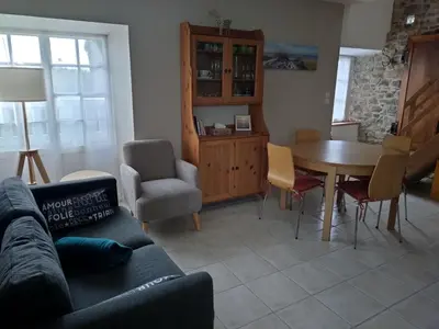 Coin salon dans l'établissement Gîte Les Pommiers