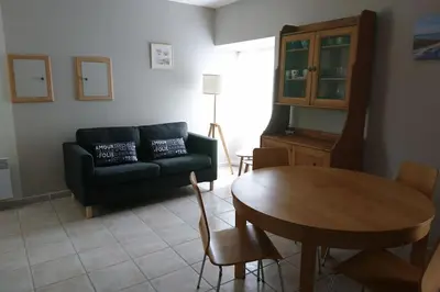 Coin salon dans l'établissement Gîte Les Pommiers
