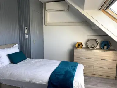 Un ou plusieurs lits dans un hébergement de l'établissement Gîte La Mouette de 4 personnes
