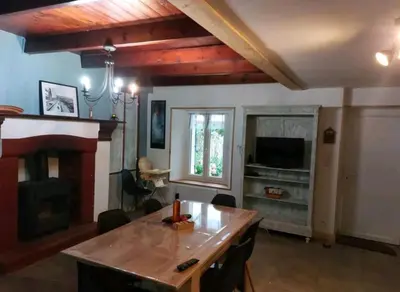 Télévision ou salle de divertissement dans l'établissement Location Bord De Mer