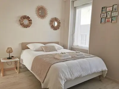 Un ou plusieurs lits dans un hébergement de l'établissement Appartement Amiral d'Aboville