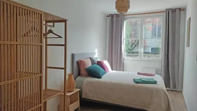 Un ou plusieurs lits dans un hébergement de l'établissement Duplex lumineux et calme en centre-ville