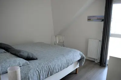 Un ou plusieurs lits dans un hébergement de l'établissement Entre Plage et Ports, Le 49 - avec balcon 4 étoiles