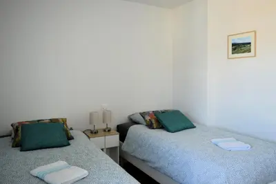 Un ou plusieurs lits dans un hébergement de l'établissement Entre Plage et Ports, Le 49 - avec balcon 4 étoiles