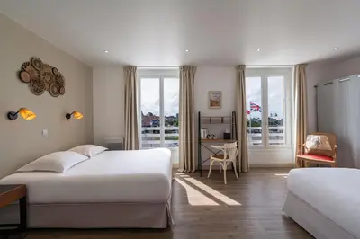 Un ou plusieurs lits dans un hébergement de l'établissement Hôtel De La Plage