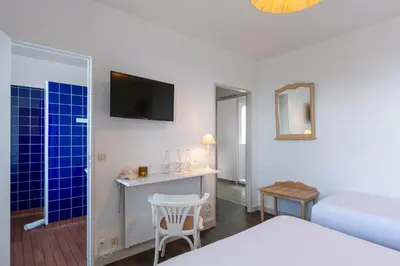 Un ou plusieurs lits dans un hébergement de l'établissement Hôtel De La Plage