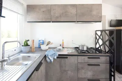 Cuisine ou kitchenette dans l'établissement Chalet Bord de Mer