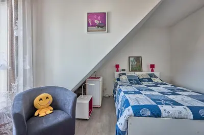 Un ou plusieurs lits dans un hébergement de l'établissement Doudounette - Appartement à proximité de la plage