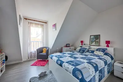 Un ou plusieurs lits dans un hébergement de l'établissement Doudounette - Appartement à proximité de la plage