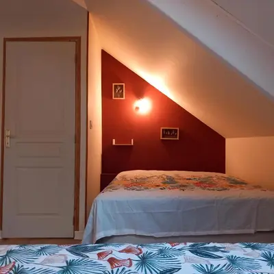Un ou plusieurs lits dans un hébergement de l'établissement gîte le petit roussel