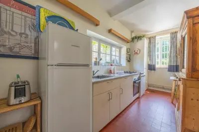 Cuisine ou kitchenette dans l'établissement Les Rabouillères - Maison à Omaha Beach