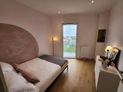 Un ou plusieurs lits dans un hébergement de l'établissement Le Davs - Splendide Appartement avec vue Panoramique - Salle de Sport et Parking Gratuit