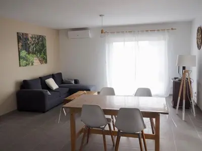 Coin salon dans l'établissement Maison 6-8 personnes 3 chambres