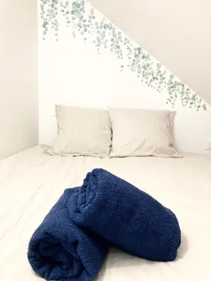 Un ou plusieurs lits dans un hébergement de l'établissement Cocon Maritime 1 chambre & 1 Mezzanine