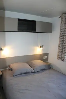 Un ou plusieurs lits dans un hébergement de l'établissement Mobil-home