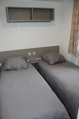 Un ou plusieurs lits dans un hébergement de l'établissement Mobil-home